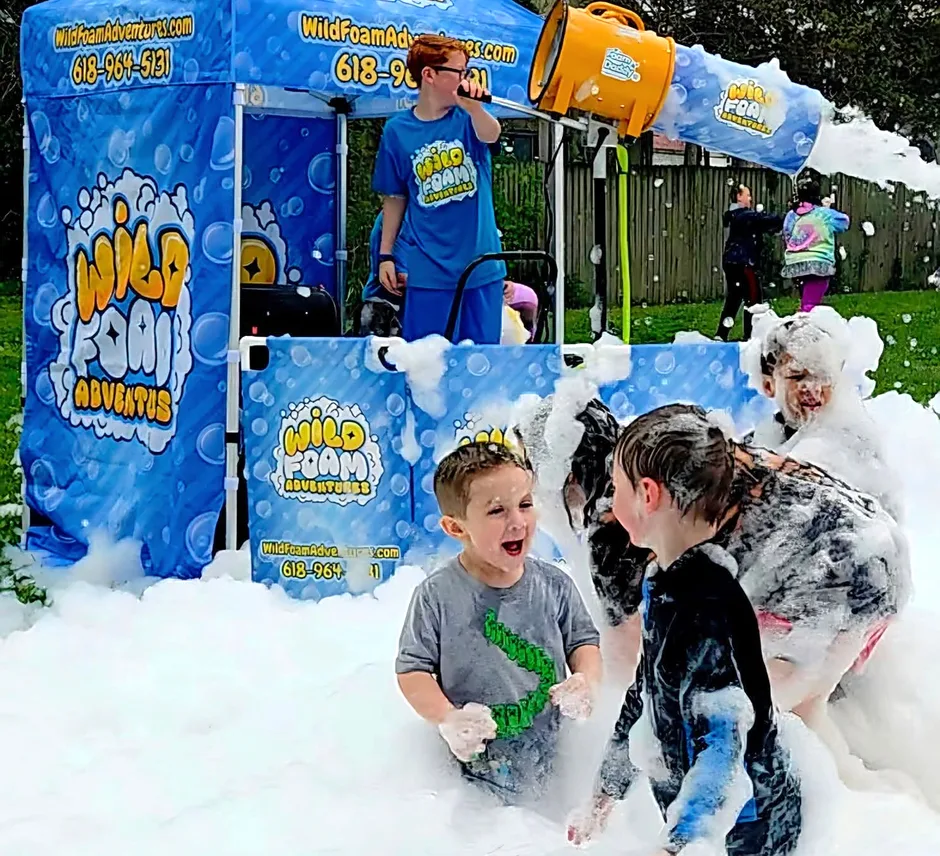 A child enjoying a foam party