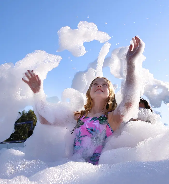 Backyard foam party with a rented cannon